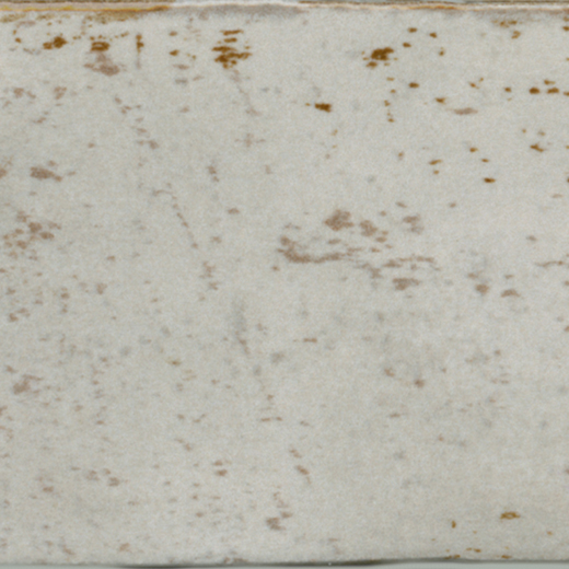 Glossy sand-colored ceramic tile with subtle brown speckles.