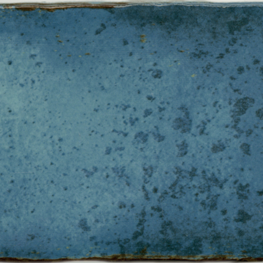 Blue ceramic tile with a glossy finish.
